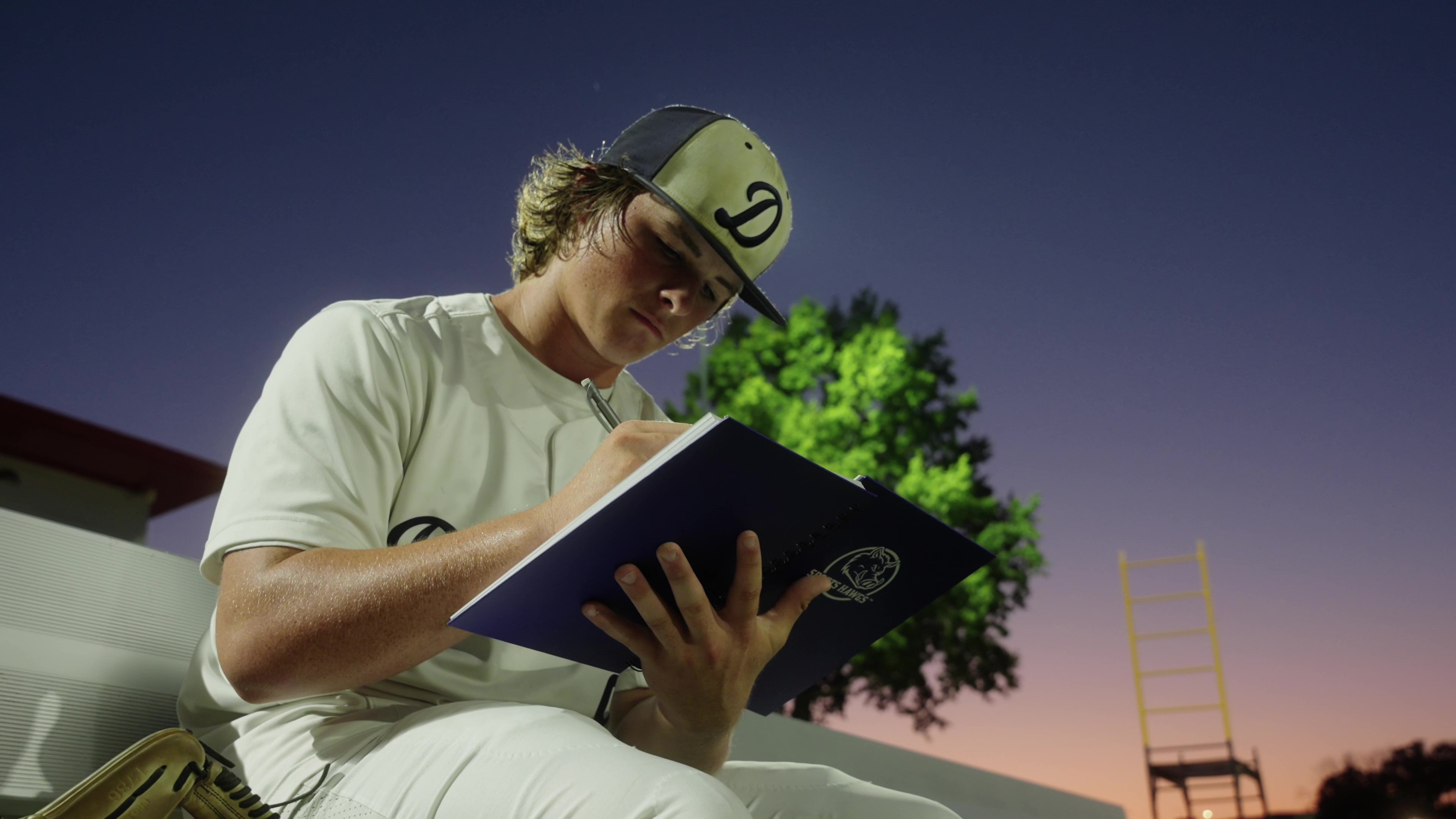 Athlete using Sports Hawgs Champion Journal to improve mental toughness, goal setting and clarity